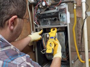 Technician working on furnace
