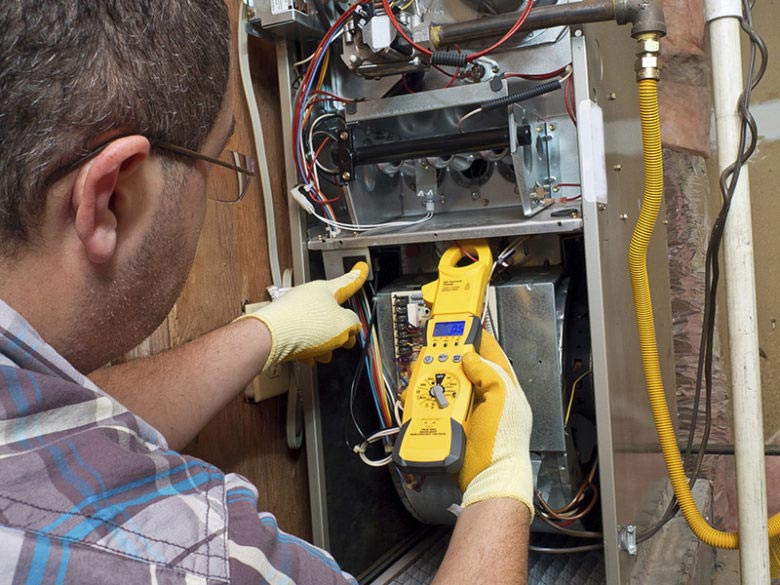 Technician working on furnace